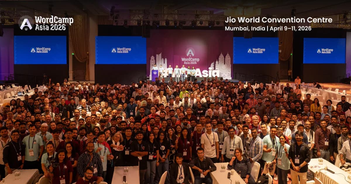 The contributor day family photo at WordCamp Asia 2026 in Mumbai, a hall packed with contributors